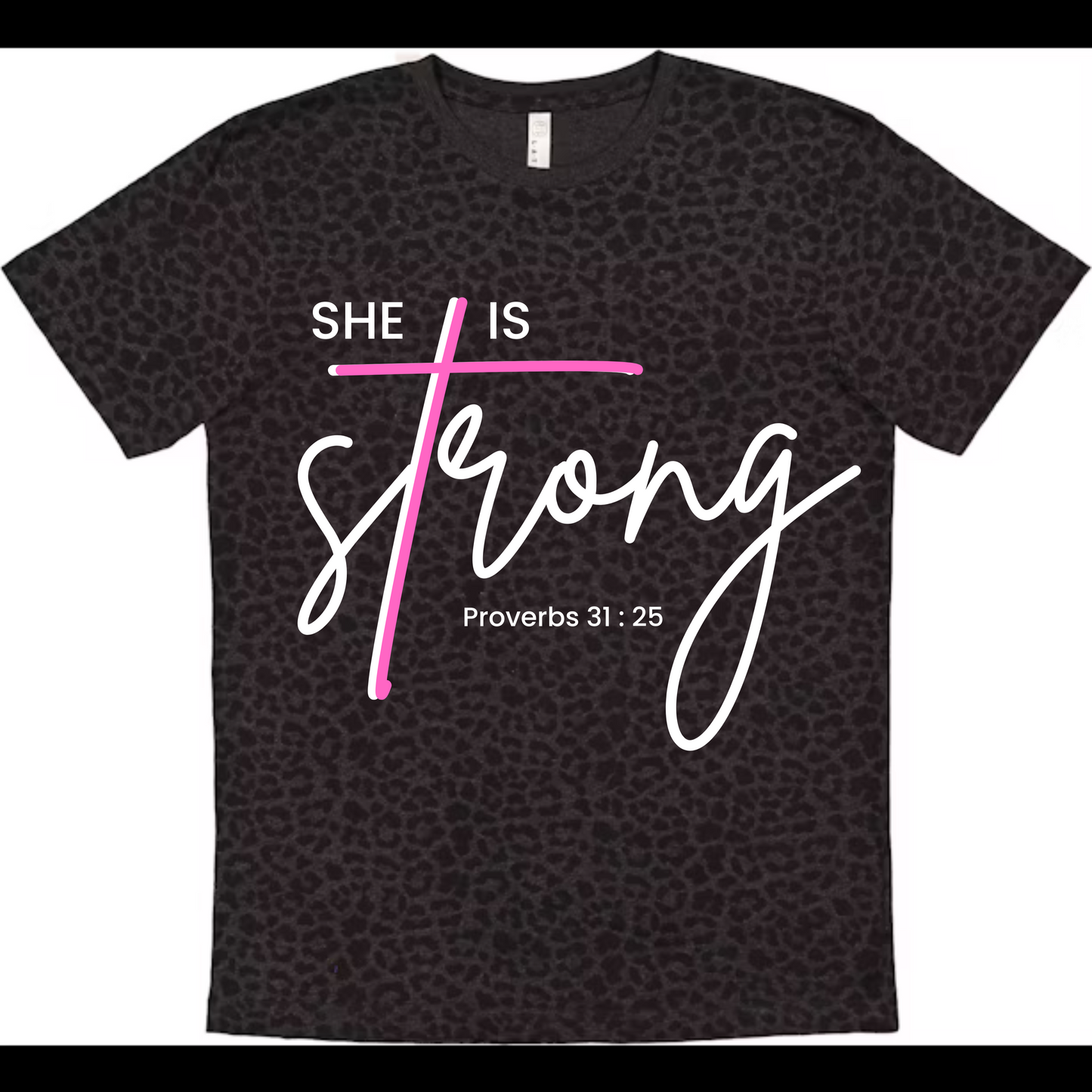 Black leopard t-shirt with 'She is Strong' text and pink cross on a white background